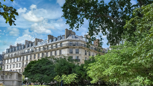 Paris, beautiful buildings rue de Rivoli, in the historic center, with a public park 