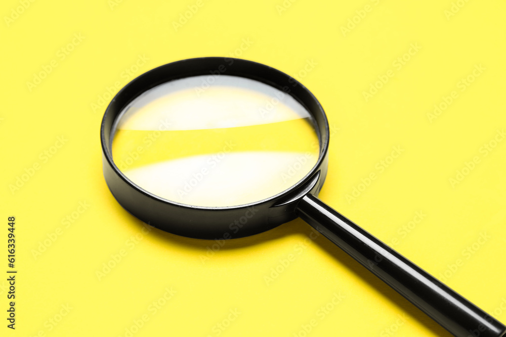 Black magnifiers on yellow background Black magnifiers on yellow background