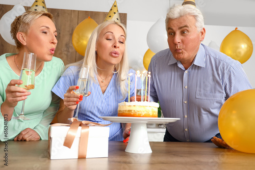 Mature people making wish a...