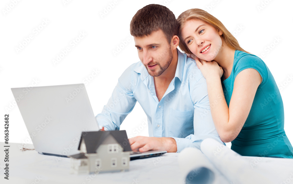 Young beautiful couple using laptop at home