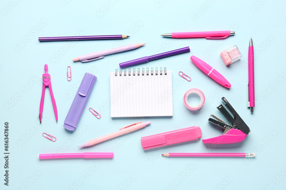 Notebook with different stationery on blue background Notebook with different stationery on blue background