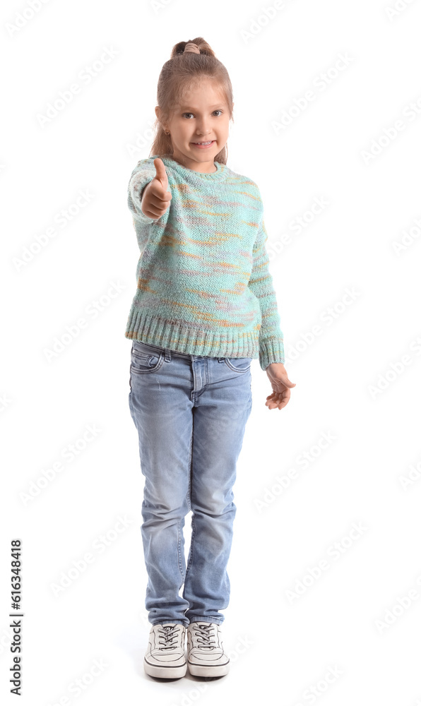 Cute little girl in knitted sweater showing thumb-up on white background Cute little girl in knitted sweater showing thumb-up on white background