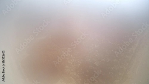 A video shows the process of boiling crude soap in a factory boiling chamber