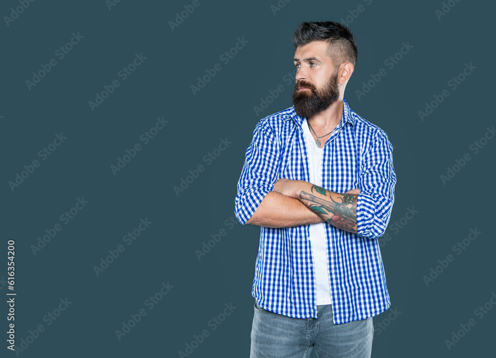 adult bearded man wear checkered shirt on grey background adult bearded man wear checkered shirt on grey background