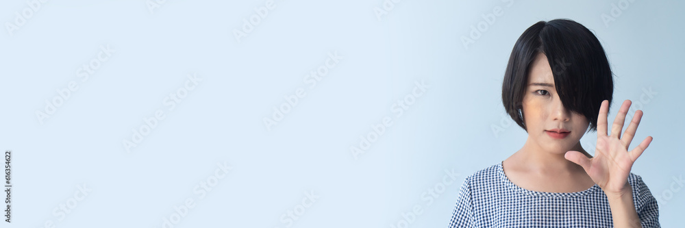 Happy smiling asian woman with short hair pointing up five fingers, 5 points gesture Happy smiling asian woman with short hair pointing up five fingers, 5 points gesture