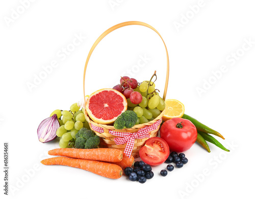 Fototapeta Naklejka Na Ścianę i Meble -  Wicker basket with different fresh fruits and vegetables on white background