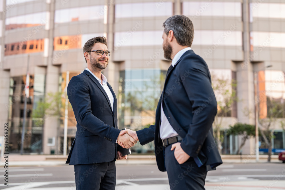 image of two businessmen deal with handshake. two businessmen deal with handshake. image of two businessmen deal with handshake. two businessmen deal with handshake.