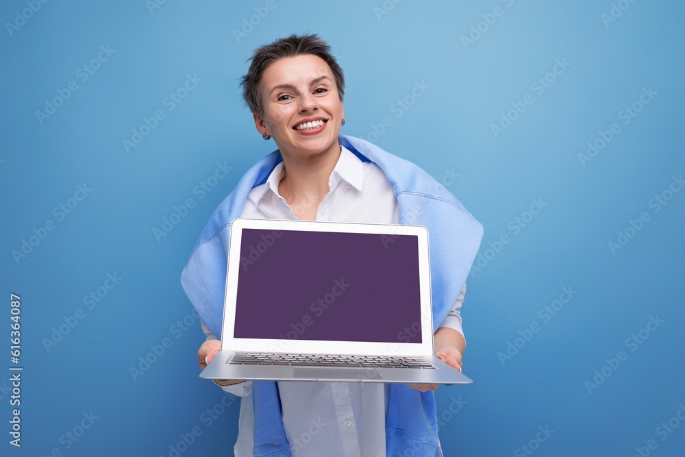 freelance business concept. young woman confidently holding laptop with mockup freelance business concept. young woman confidently holding laptop with mockup