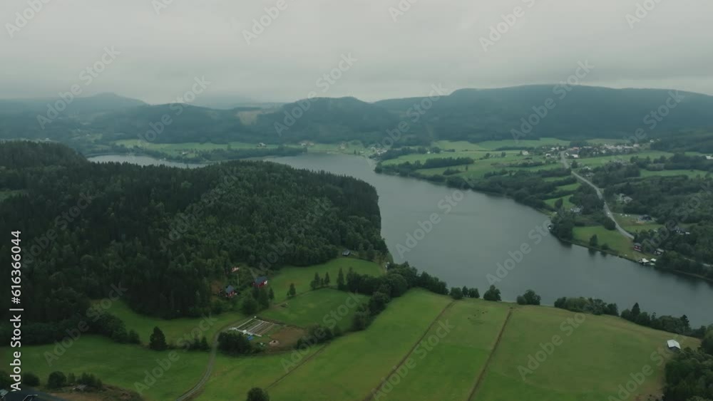 Epic panoramic shot of long river and nordic forests on cold, grey day Epic panoramic shot of long river and nordic forests on cold, grey day