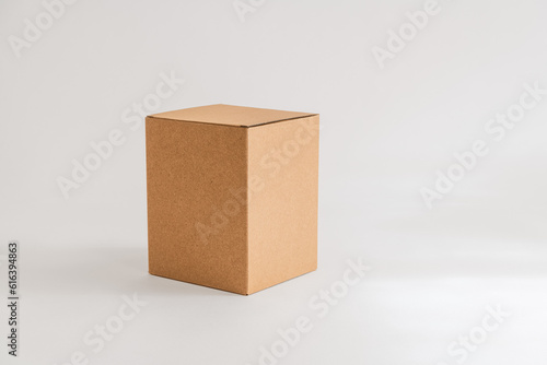Closed cardboard box on white background