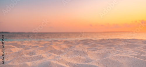 Fototapeta Naklejka Na Ścianę i Meble -  Closeup beach coast sand texture with warm gold orange sunset light. Fantasy beach landscape sky sea bay. Tranquil relax bright horizon, colorful sky. Peaceful nature seascape. Summer Mediterranean