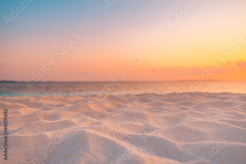 Closeup beach coast sand texture with warm gold orange sunset light. Fantasy beach landscape sky sea bay. Tranquil relax bright horizon, colorful sky. Peaceful nature seascape. Summer Mediterranean