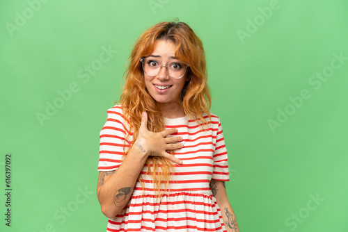 Young caucasian woman isolated on green screen chroma key background pointing to oneself photo