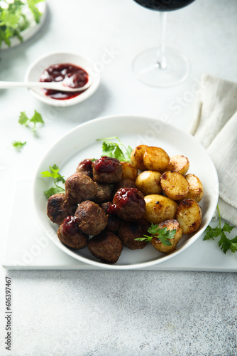 Homemade veal meatballs with potato and berry sauce