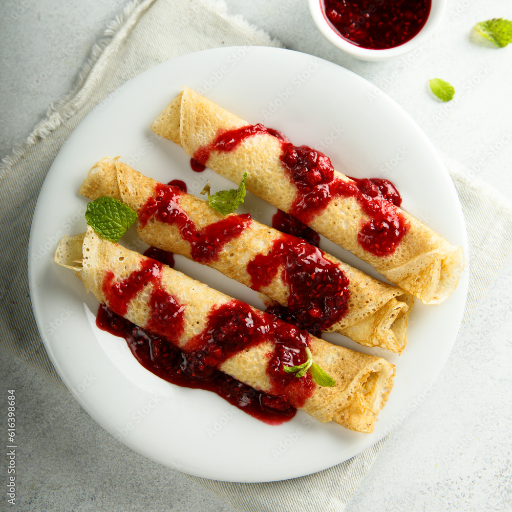 Homemade crepes with raspberry sauce Homemade crepes with raspberry sauce