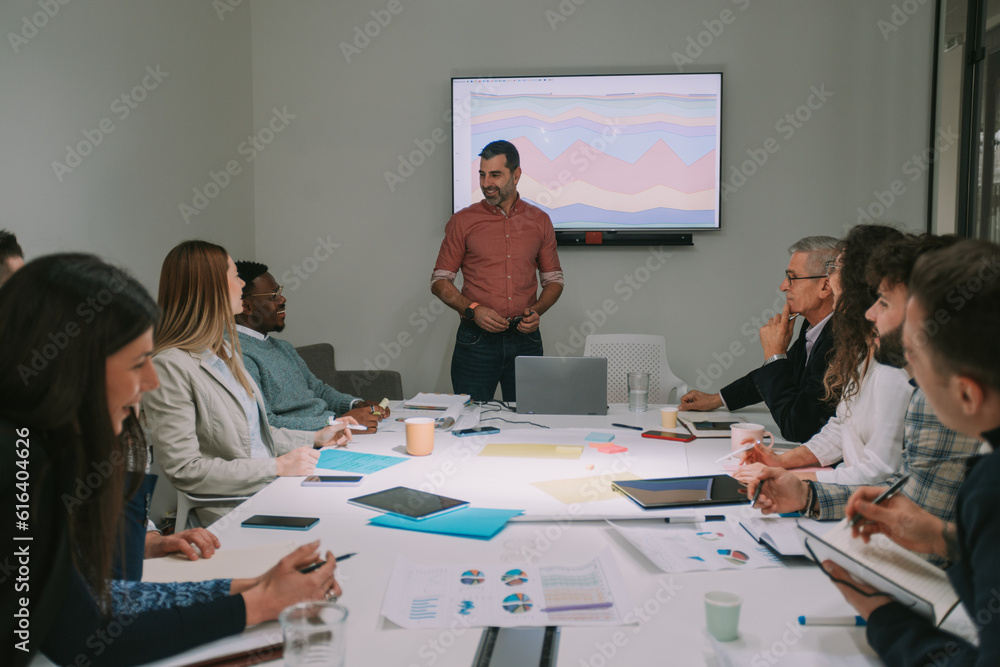 Close up of business man standing in front of the presentation and talking Close up of business man standing in front of the presentation and talking