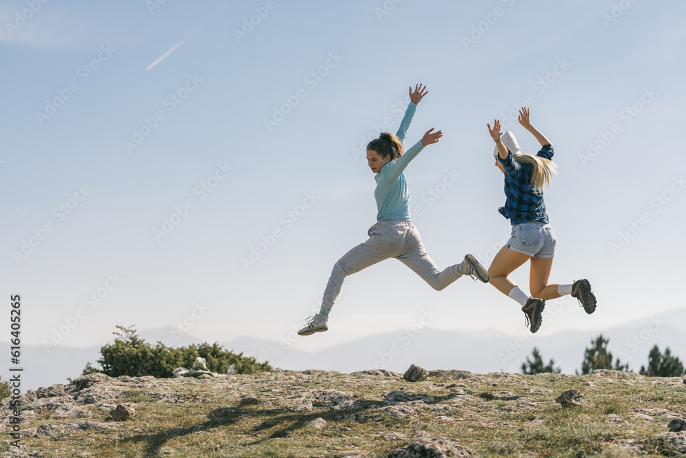 Sexy happy girls having fun on top of the mountain Sexy happy girls having fun on top of the mountain