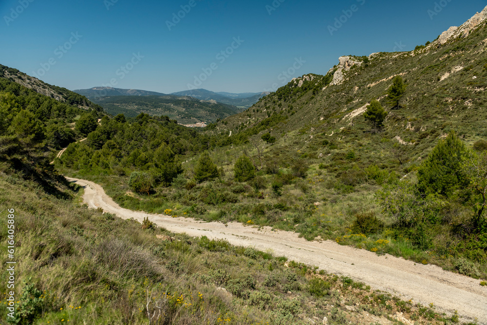 Small gravel mountain road passing over a mountain range, Costa Blanca, Alicante, Spain Small gravel mountain road passing over a mountain range, Costa Blanca, Alicante, Spain