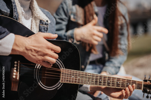 Close up of man playing guitar