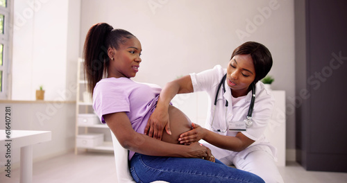 Pregnant Woman Massage By Doula. Baby Care