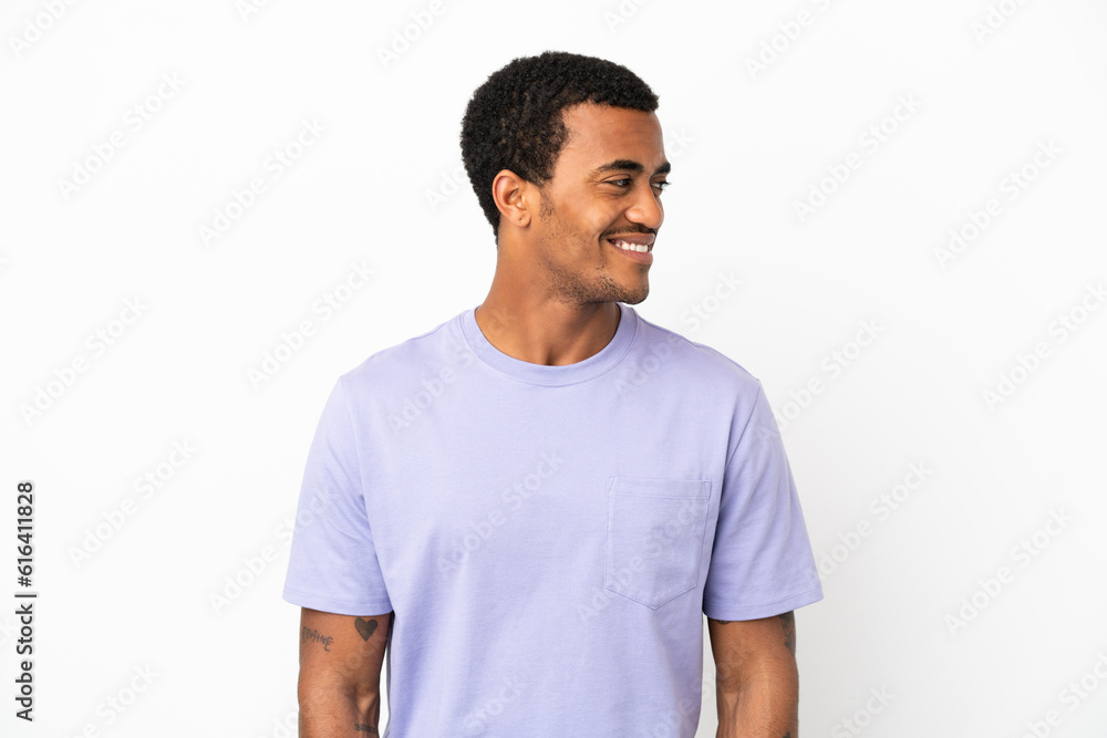 Fototapeta premium African American handsome man on isolated white background looking side