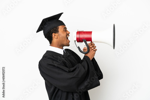 African American university graduate man over isolated white background shouting through a megaphone
