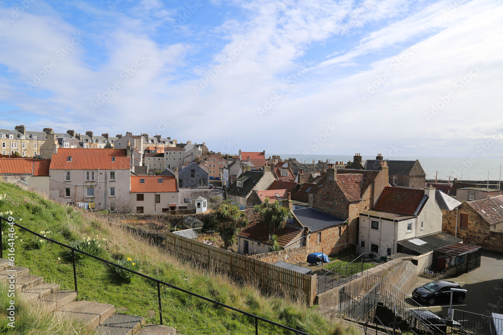 A view across the village houses of St. Monans sitting on a hillside above the Firth of Forth in Scotland, UK.