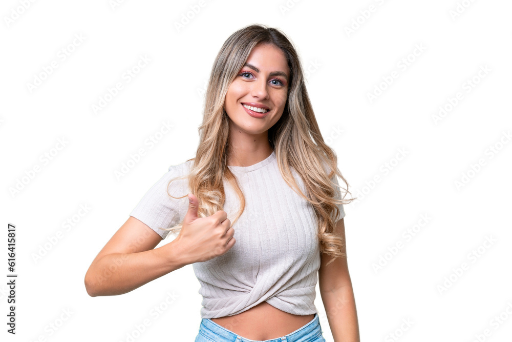 Young Uruguayan woman over isolated background giving a thumbs up gesture Young Uruguayan woman over isolated background giving a thumbs up gesture