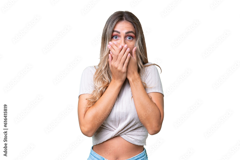 Young Uruguayan woman over isolated background covering mouth with hands Young Uruguayan woman over isolated background covering mouth with hands