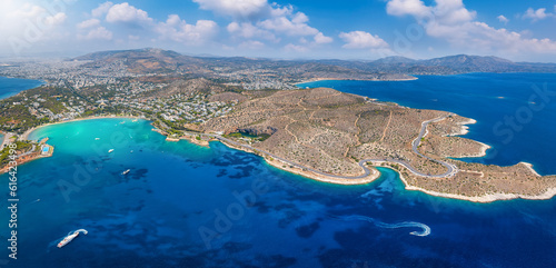 Panoramic aerial view of the Vouliagmeni district in south Athens, Greece, with beach, the Limanakia bays and Varkiza town in the background