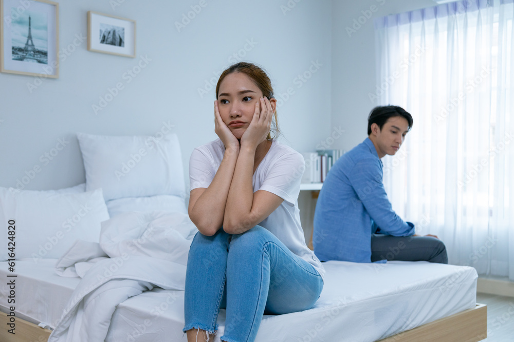 Young couple watching tv series laughing happily using tablet and sitting on sofa bed
Young couple watching tv series laughing happily using tablet and sitting on sofa bed