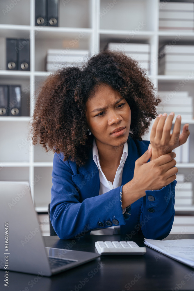 Woman have wrist pain after work hard in office feeling so pain and