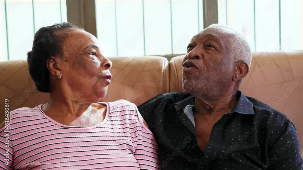 Happy Black Senior Couple Engaging in Conversation on Couch, Old Age Relationship Happy Black Senior Couple Engaging in Conversation on Couch, Old Age Relationship