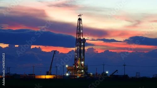 Close-up oil drilling rig in the field time lapse