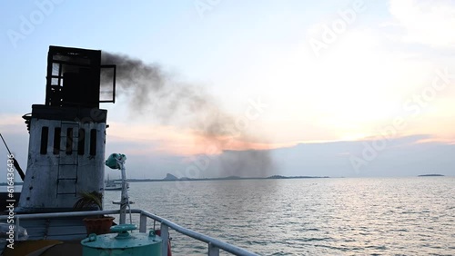 Smoke from black chimneys on board ferries or cruise ships