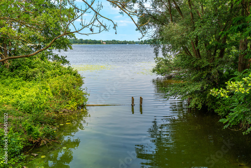 The Jungfernsee is a part of the Havel waterway in the north of Potsdam in the state of Brandenburg. In the foreground the mouth of the idyllic Hasengraben Canal. photo