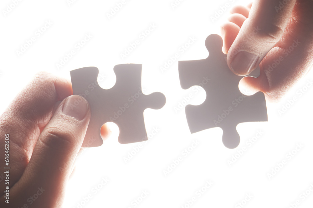 Puzzle, synergy and solution with hands of person on white background for achievement, goal and development. Mission, game and cooperation with jigsaw pieces for support, success and integration Puzzle, synergy and solution with hands of person on white background for achievement, goal and development. Mission, game and cooperation with jigsaw pieces for support, success and integration