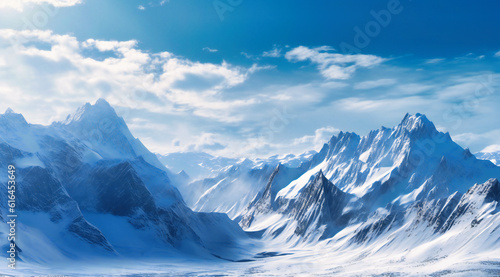 a mountain range with snow is shown in the midst of blue skies © Nilima