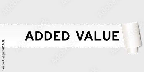 Ripped gray paper background that have word added value under torn part