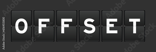 Black color analog flip board with word offset on gray background