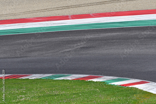 colored curbs on a racing track © Dan74