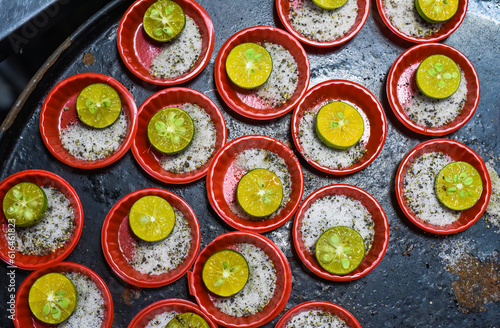 Many prepared plates with vietnamese spices with salt, pepper, lime