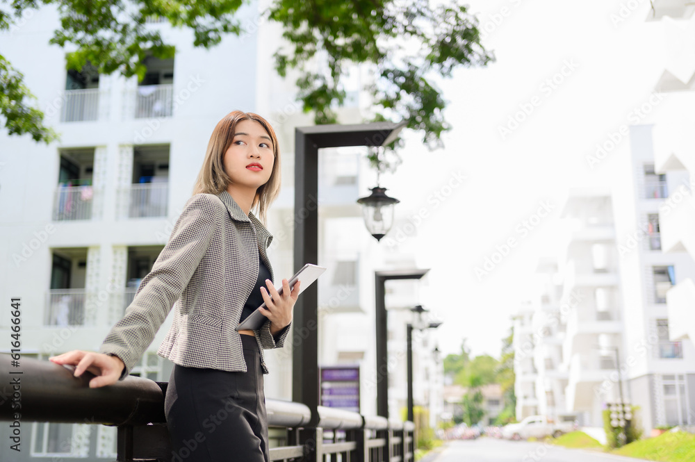 asian manager businesswoman use tablet for working online outdoor asian manager businesswoman use tablet for working online outdoor