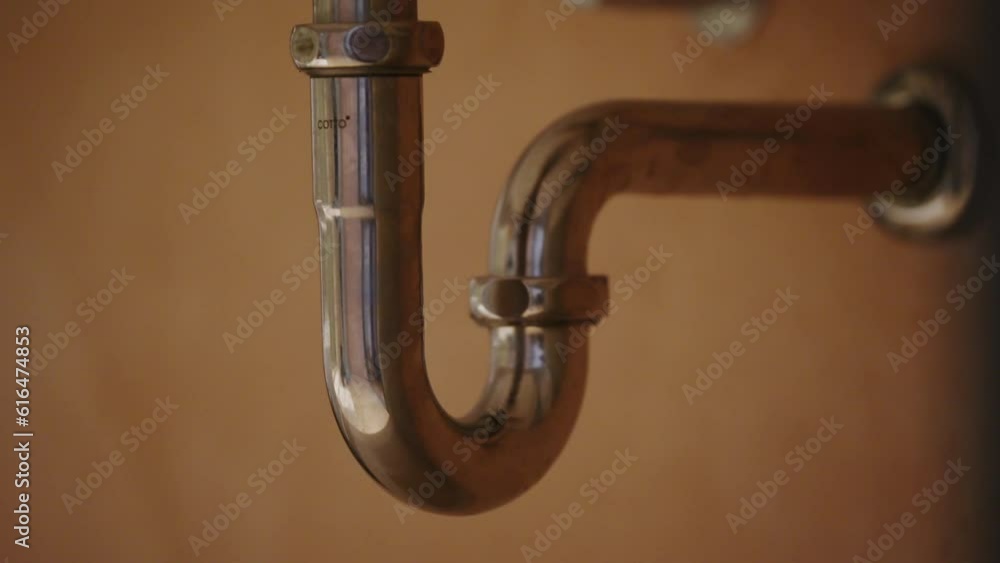 leaking sink trap. broken siphon. sewage water leakage. StockVideo