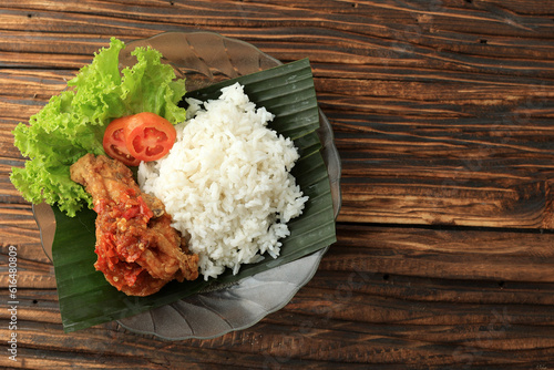 Ayam Geprek Sambal BAwang with Steamed White Rice. photo