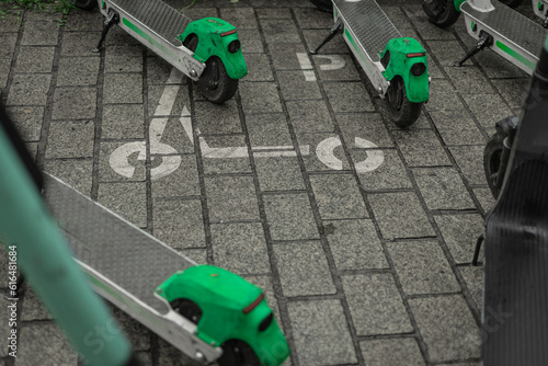 Floor marking or pictogram for electric scooter station. Drawing of a scooter on the floor to denote dedicated place to park rental electric scooters in the city.