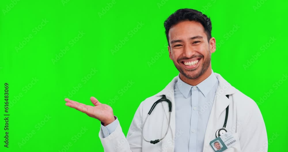 Healthcare, green screen and presentation with a doctor man on a studio background to recommend a product. Portrait, medical and palm with a happy young male medicine professional on chromakey mockup Healthcare, green screen and presentation with a doctor man on a studio background to recommend a product. Portrait, medical and palm with a happy young male medicine professional on chromakey mockup