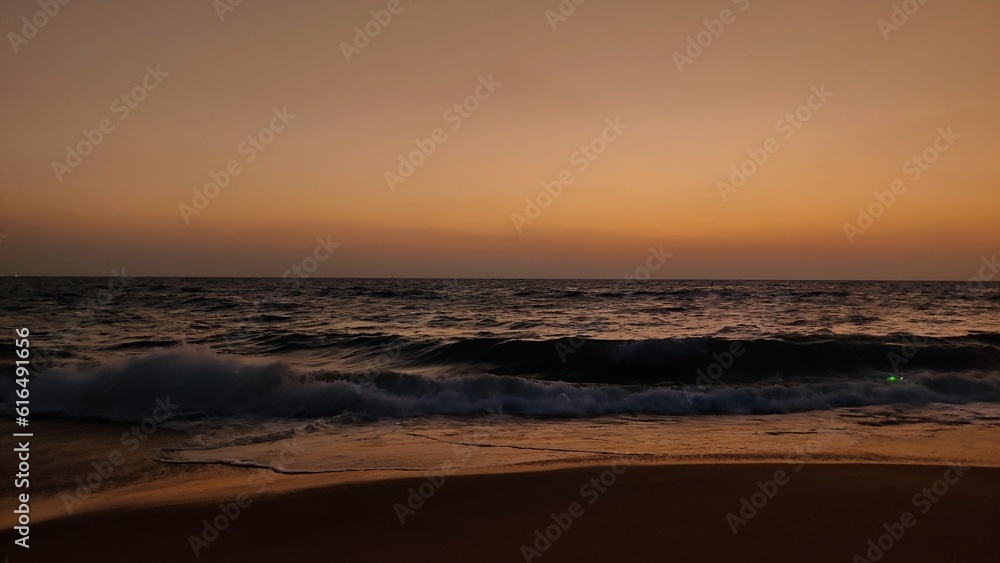 the evening sky at the beach with the waves of the sea the evening sky at the beach with the waves of the sea