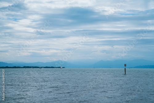 Obraz na płótnie Germany, bodensee lake constance panorama view above water surface to alps mountains with rain and thunderstorm in summer w salonie