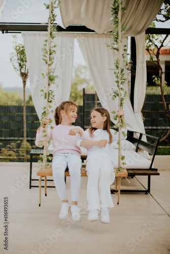 Cute little girls on the sw...